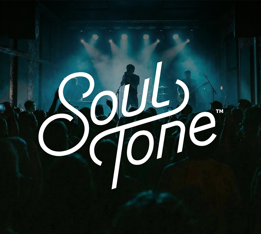 A band performs on a dimly lit stage with blue lighting and a crowd in the foreground. The stylized text “Soul Tone” is prominently displayed over the image.